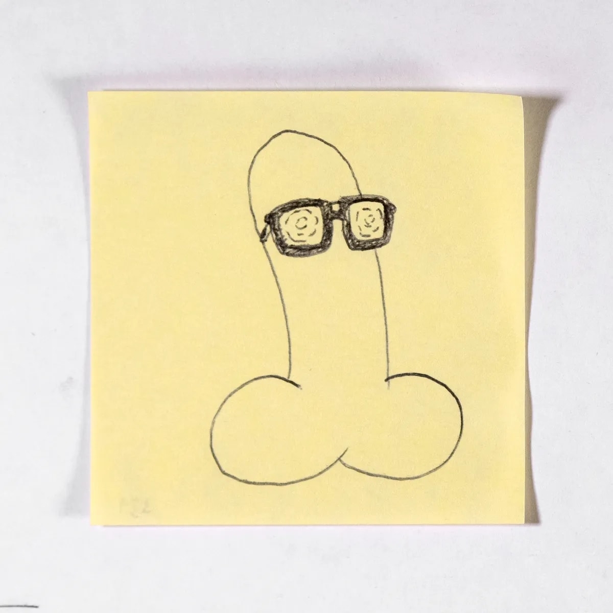 Glasses, No. 331 of 512: a hand-drawn cazzo on a sticky note